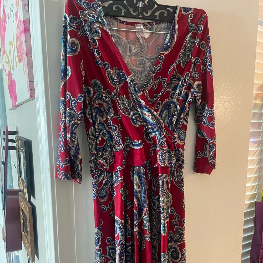 Pretty red v neck dress with designs . Stretchy and comfortable